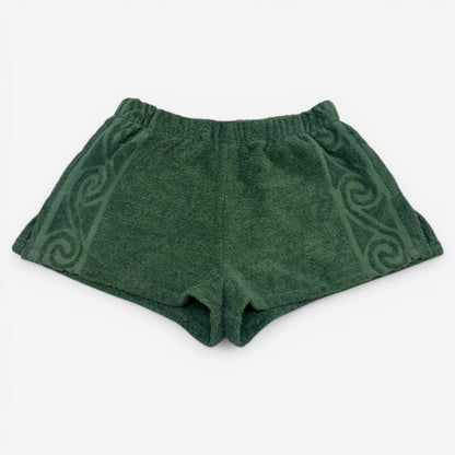 Green shorts with a pattern on a white background