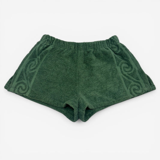 Green shorts with a pattern on a white background
