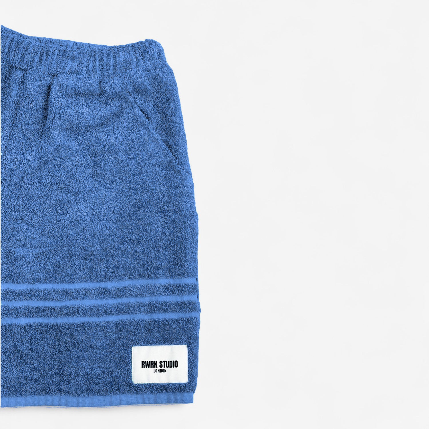 Blue towel with a label on a white background